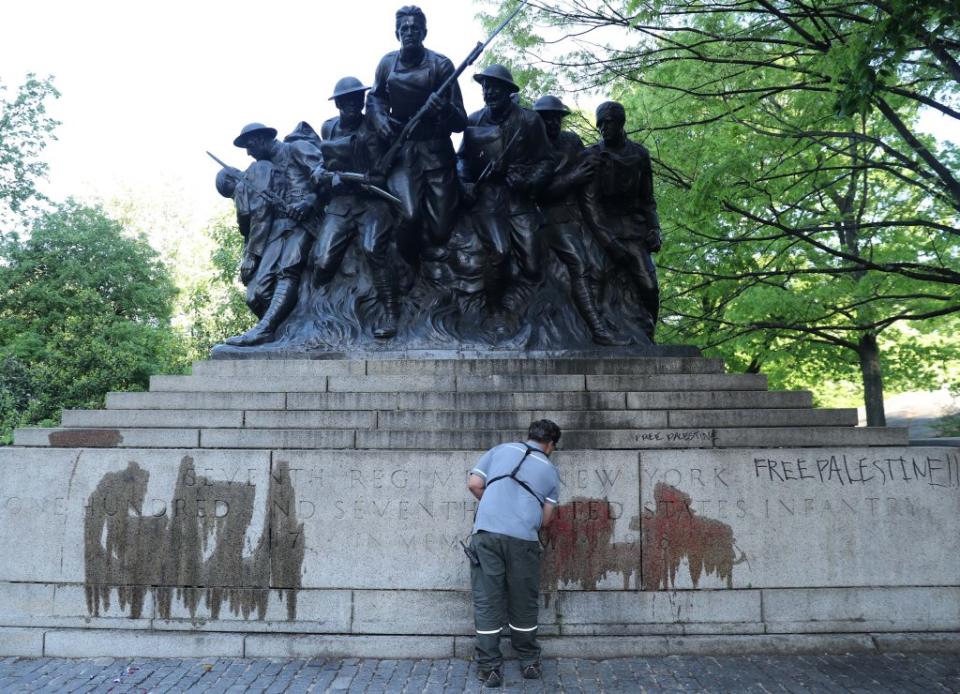 Clean-up crews arrived early Tuesday to scrub the historic World War I memorial in Central Park that was vandalized by anti-Israeli protesters overnight. G.N.Miller/NYPost