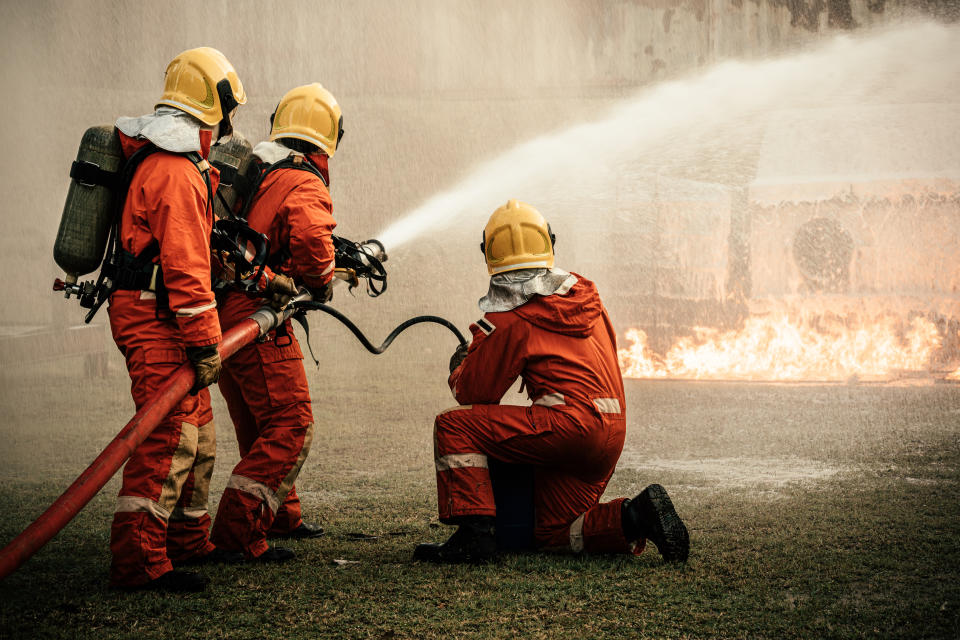 Firefighters team working to put out fire