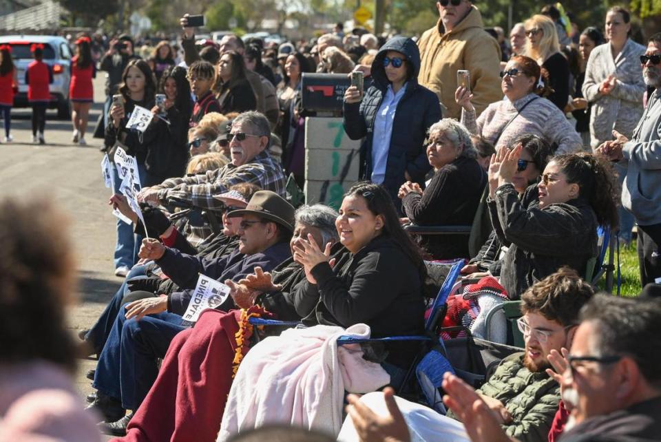 Pinedale residents line the streets around the Pinedale Community Center while watching the parade to celebrate Pinedale’s centennial on Saturday, March 25, 2023. The community in north Fresno is celebrating the 100th anniversary of its establishment.