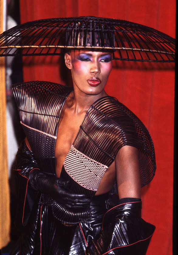 Grace Jones is a multi-tasker. She can sing, dance, act and model. And regardless of what she’s doing – whether it’s performing on stage, walking the catwalk or attending an A-list party – you can always count on Grace to make an outlandish fashion statement. She has a penchant for capes, Lycra, fur, corsets and body paint.