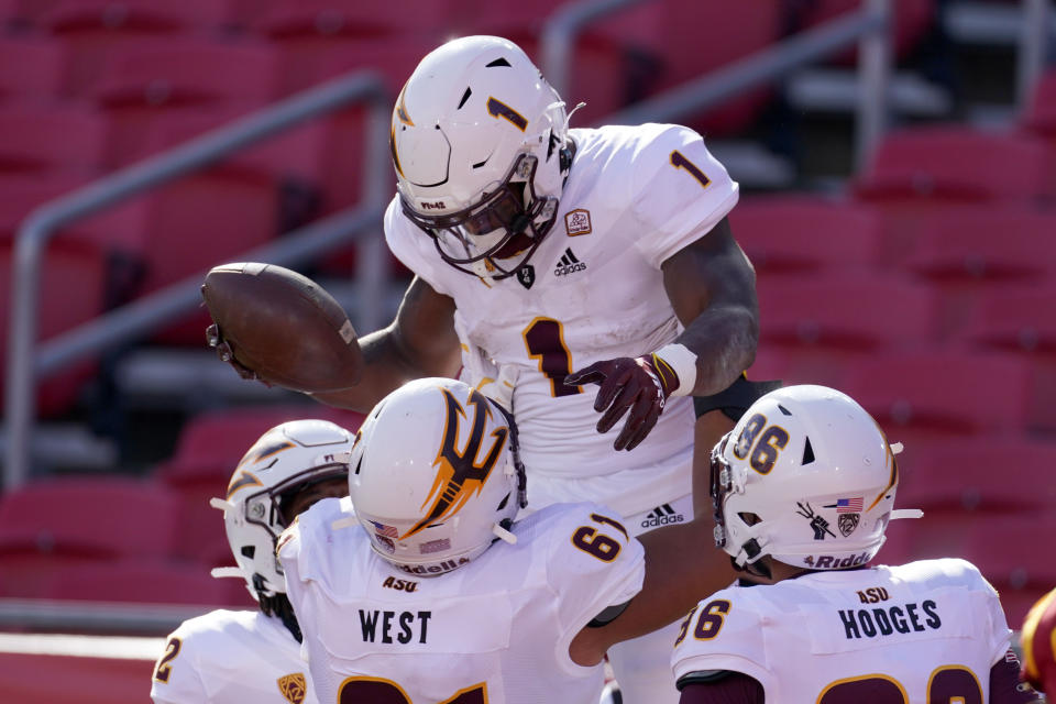 Nov 7, 2020; Los Angeles CA, USA; Arizona State Sun Devils running back DeaMonte Trayanum (1) celebrates with offensive lineman <a class="link " href="https://sports.yahoo.com/nfl/players/34515" data-i13n="sec:content-canvas;subsec:anchor_text;elm:context_link" data-ylk="slk:Kellen Diesch;sec:content-canvas;subsec:anchor_text;elm:context_link;itc:0">Kellen Diesch</a> (74) after scoring on a 25-yard touchdown run in the second quarter against the Southern California Trojans at the Los Angeles Memorial Coliseum. Mandatory Credit: Kirby Lee-USA TODAY Sports