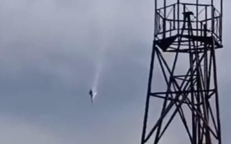 A plane falling in the sky near the village of Kuzhenkino, Tver region