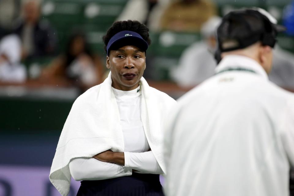 Venus Williams reacts to the rain coming down during her round one match against Nao Hibino at the BNP Paribas Open in Indian Wells, Calif., on Wednesday, March 6, 2024.