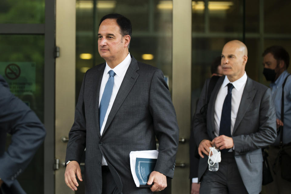 Michael Sussmann, left, a cybersecurity lawyer who represented the Hillary Clinton presidential campaign in 2016, leaves federal courthouse in Washington, Monday, May 16, 2022. A jury was picked Monday in the trial of a lawyer for the Hillary Clinton presidential campaign who is accused of lying to the FBI as it investigated potential ties between Donald Trump and Russia in 2016. (AP Photo/Manuel Balce Ceneta)