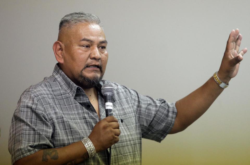 FILE - This Aug. 22, 2016, file photo, Navajo Nation lawmaker Davis Filfred speaks during a meeting with the Navajo Tribal Utility Authority at the Red Mesa Chapter, near Montezuma Creek, Utah. Native Americans who have long bemoaned their lack of participation in federal land decisions scored a major victory when President Barack Obama designated a new national monument in Utah that gives five tribes an opportunity to weigh in on the management of their ancestral home. Filfred has said he and others are worried, but they are trying to stay hopeful that the administration will give the commission a legitimate voice. (AP Photo/Rick Bowmer, File)