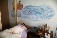 <p>Immigrant Rosa Sabido wakes up in the United Methodist Church in which she lives while facing deportation in Mancos, Colo., July 19, 2017. (Photo: Lucy Nicholson/Reuters) </p>