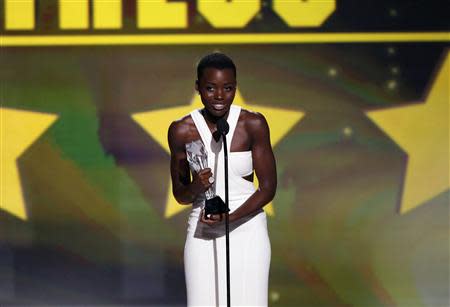 Actress Lupita Nyong'o accepts the award for best supporting actress for her role in "12 Years a Slave" at the 19th annual Critics' Choice Movie Awards in Santa Monica, California January 16, 2014. REUTERS/Mario Anzuoni