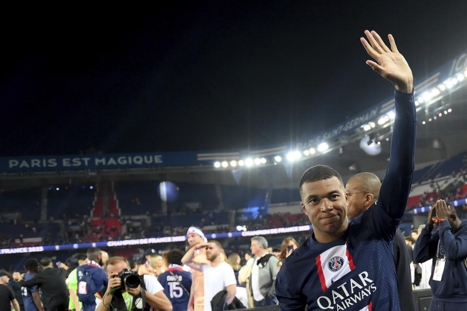 Paris Saint-Germain's French forward Kylian Mbappe waves following the team's French League One soccer match loss to Clermont, at Parc des Prince stadium in Paris, Saturday, June 3, 2023. Despite the loss, PSG finished as the French league champion. (Franck Fife/Pool Photo via AP)