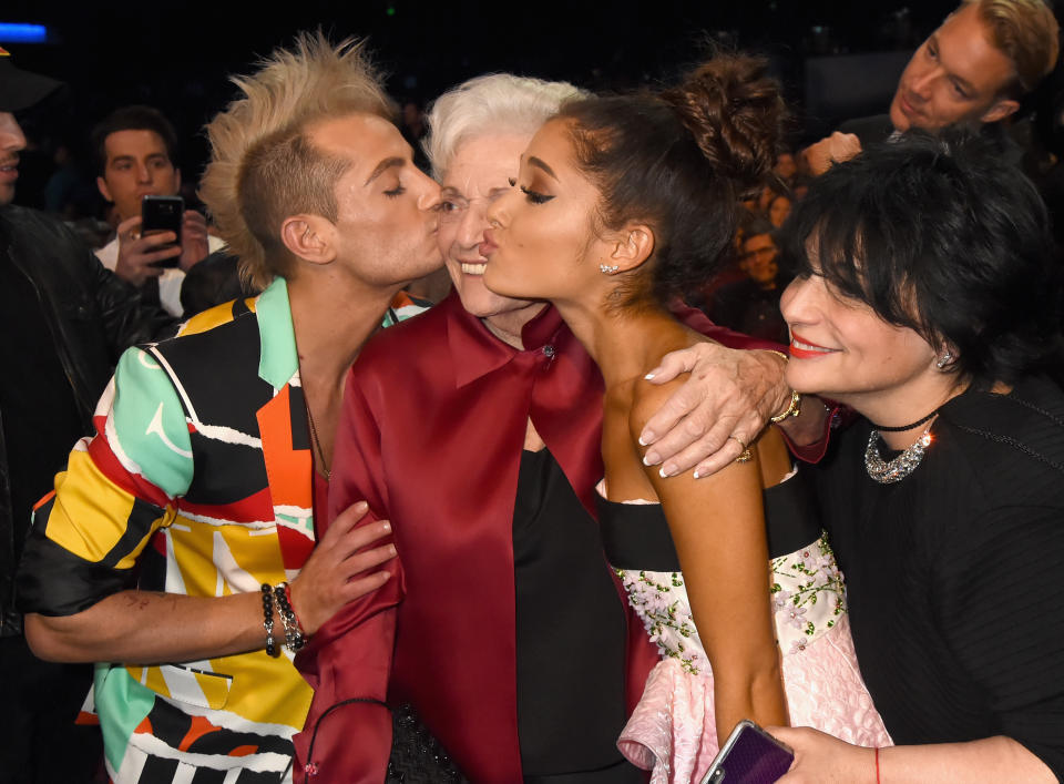 Ariana and Frankie Grande are half-siblings (they share the same mother, Joan Grande).  Seen here with their maternal grandmother Marjorie Grande at the 2015 American Music Awards.  (Jeff Kravitz / AMA2015 / FilmMagic)