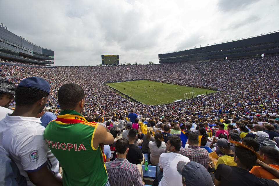 FILE - In this July 30, 2016, file photo, over 100,000 fans attend an International Champions Cup soccer match between Real Madrid and Chelsea at Michigan Stadium in Ann Arbor, Mich. The crippling grip the coronavirus pandemic has had on the sports world has forced universities, leagues and franchises to evaluate how they might someday welcome back fans. And while opinions vary from level to level, sport to sport and even nation to nation, one thing is universally clear: There won't be 100,000-plus fans packed into Michigan Stadium this fall, or 16,300 seated to the rafters of Allen Fieldhouse when hoops season rolls around. (AP Photo/Tony Ding, Fle)