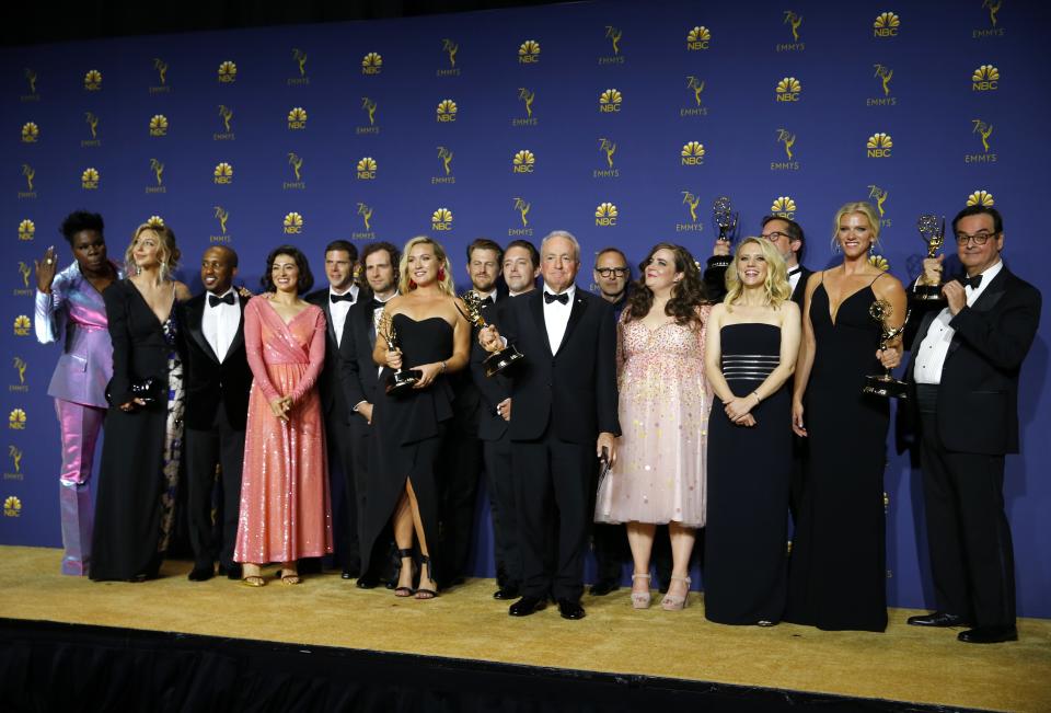 Lorne Michaels (C) poses with his cast and crew backstage after winning the Outstanding Variety Sketch Series award for <i>Saturday Night Live</i>. REUTERS/Mike Blake