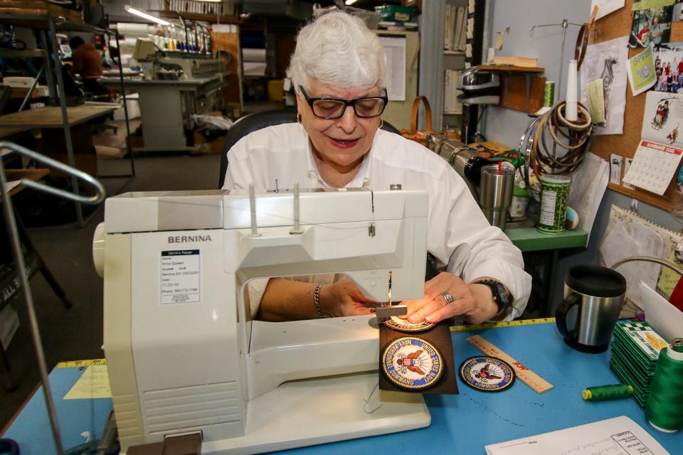 Owner Irma Speed stitches patches at her Wings & Things Monogramming location on W. Navy Boulevard on Friday, Dec. 6, 2019. Wings & Things, open since 1987, began as Irma's Monogramming in 1976, and has two locations on Navy Blvd. The business happily provides sewing, embroidering, and monogramming for the area's military community, including the Blue Angels.