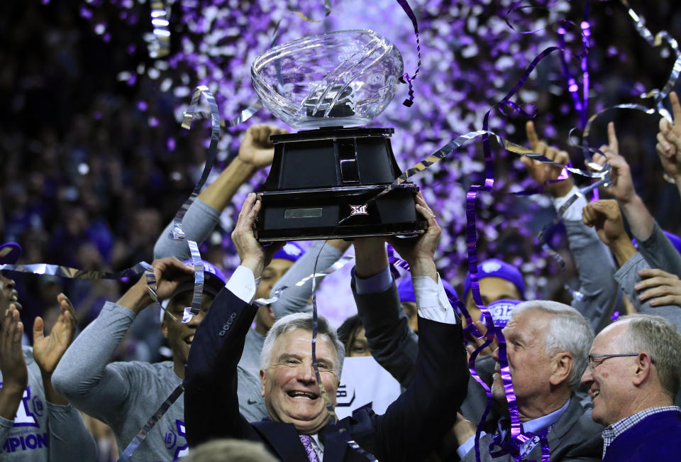 Kansas State head coach Bruce Weber holds the Big 12 trophy following an NCAA college basketball game against Oklahoma in Manhattan, Kan., Saturday, March 9, 2019. Kansas State defeated Oklahoma 68-53. Kansas State shares the regular season title with Texas Tech. (AP Photo/Orlin Wagner)
