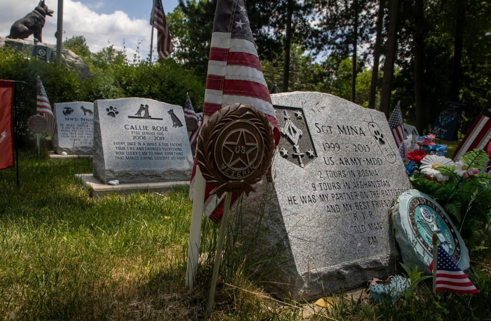 Over a dozen gravestones of dogs who served in war rest inside the Michigan War Dog Memorial in South Lyon on June 14, 2023.