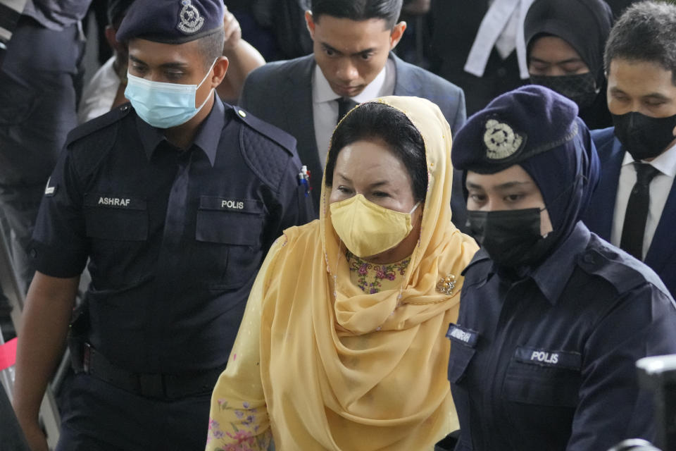 Rosmah Mansor, center, wife of former Malaysian Prime Minister Najib Razak, arrives at Kuala Lumpur High Court in Kuala Lumpur, Thursday, Sept. 1, 2022. The wife of jailed ex-Prime Minister Najib Razak arrived in court Thursday, for a verdict in her corruption trial involving a 1.25 billion ringgit ($279 million) solar energy project, just days after her husband was imprisoned over the looted 1MDB state fund. (AP Photo/Vincent Thian)