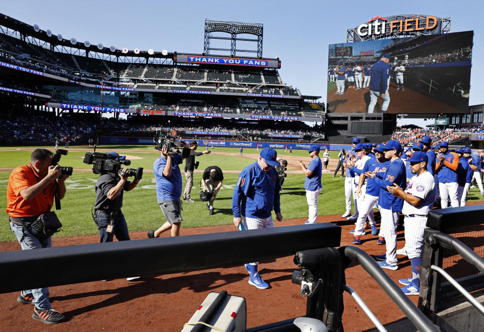 New York Mets manager Buck Showalter goes to the dugout before the start of baseball game against the Philadelphia Phillies, Sunday, Oct. 1, 2023, in New York. (AP Photo/Noah K. Murray)
