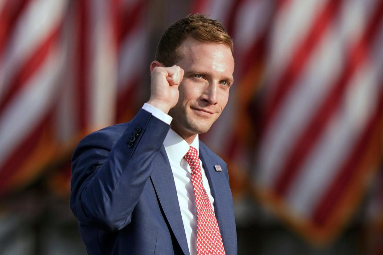 Republican congressional candidate Max Miller pumps his fist before speaking at a rally at the Lorain County Fairgrounds, in this , June 26, 2021 file photo, in Wellington, Ohio.