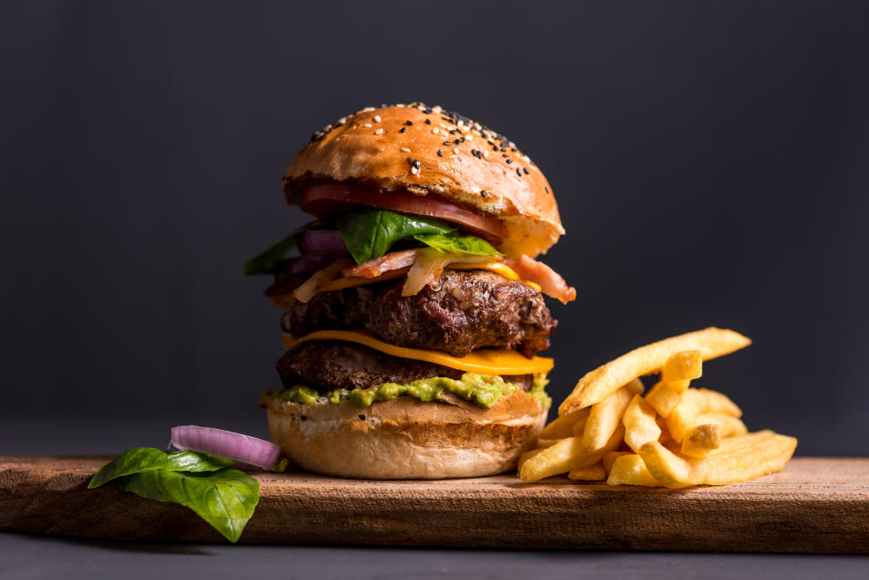 a tall stacked cheeseburger