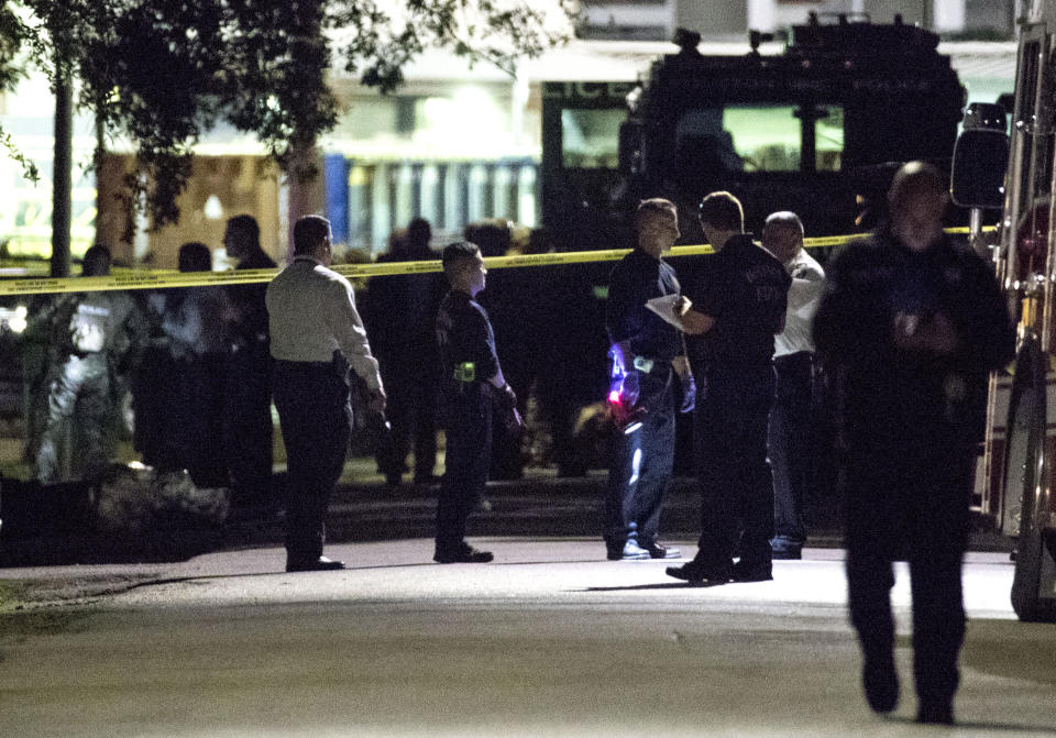 FILE - In this Jan. 28, 2019, file photo, police investigate the scene of a drug raid in Houston. A woman was sentenced on Tuesday, June 8, 2021, to three years and four months in federal prison for making false 911 calls that ultimately resulted in the 2019 drug raid by Houston police that killed both homeowners. Patricia Garcia was the first person to be sentenced in connection with the deadly raid in which Dennis Tuttle, 59, and his wife, Rhogena Nicholas, 58, were fatally shot on Jan. 28, 2019. (Brett Coomer/Houston Chronicle via AP, File)