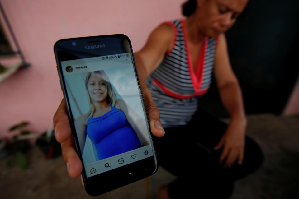 Carolina Gil shows a picture of her daughter Maroly Bastardo, at her home in El Tigre, Venezuela, on June 4. (Photo: Ivan Alvarado/Reuters)