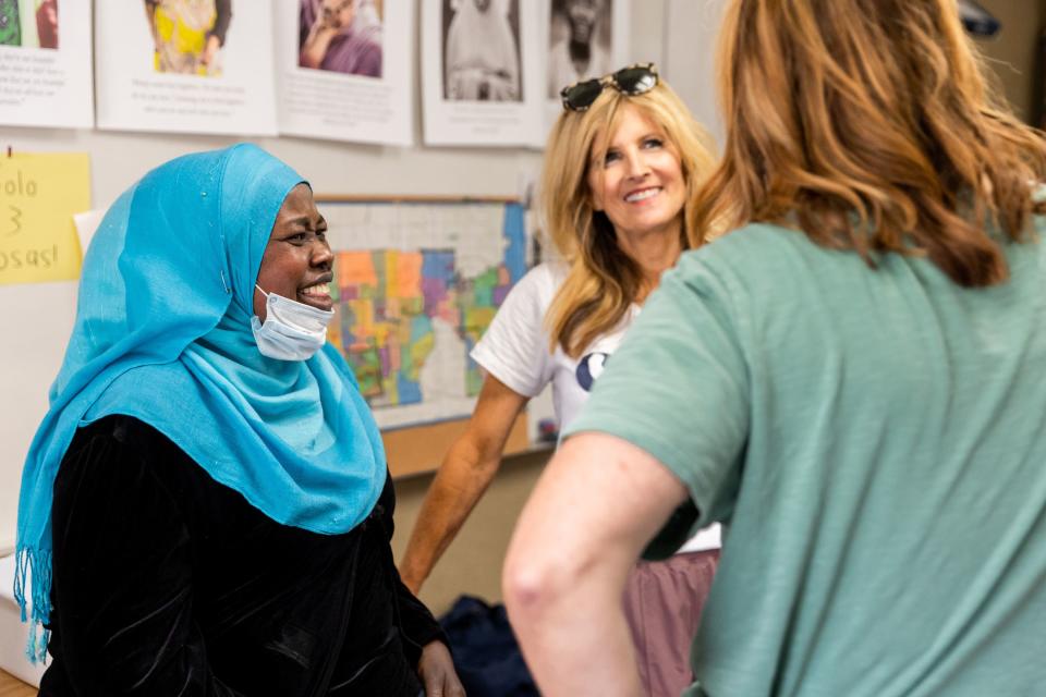 Zinab, left, from Sudan, talks to Suzanne Headden, Sharehouse manager, and Amy Dott Harmer, right, executive director for the Utah Refugee Connection, at the Serve Refugees Sharehouse in South Salt Lake on Thursday, July 13, 2023. | Megan Nielsen, Deseret News
