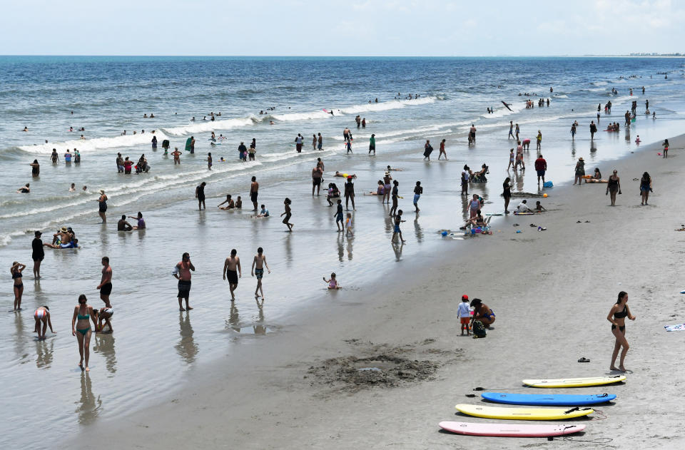 Beachgoers cool off in the surf on July 29, 2023 in Cocoa Beach, Florida. Ocean temperatures around the Florida Keys reached 101 degrees F (38 C) this week, a possible record. (Photo by Paul Hennesy/Anadolu Agency via Getty Images)