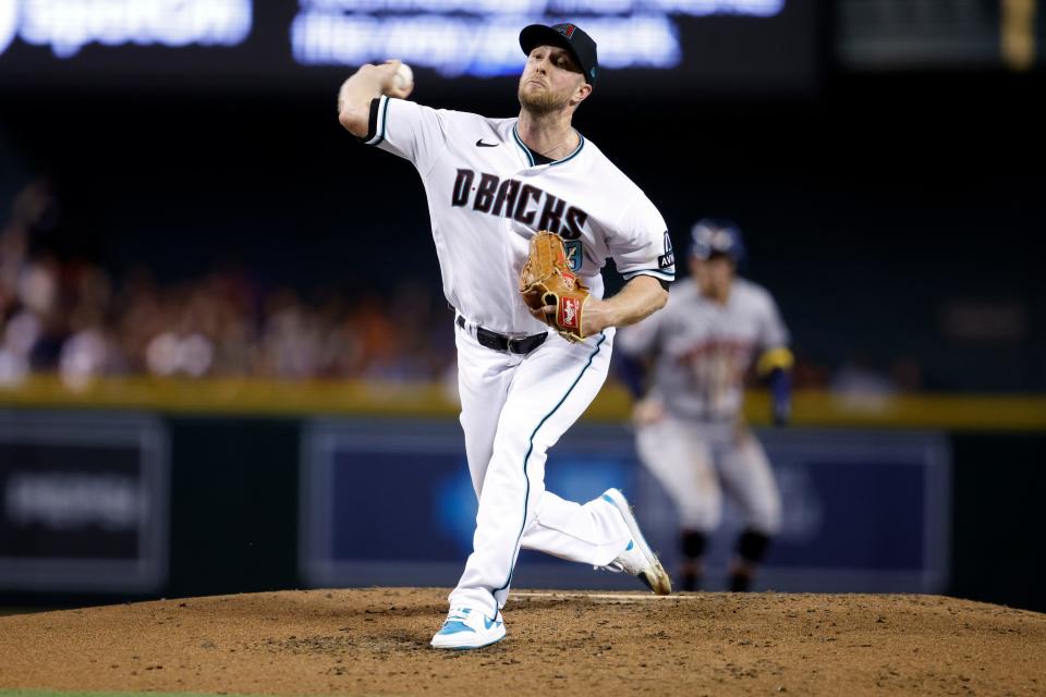 Diamondbacks' Merrill Kelly delivers a pitch against the Astros during the third inning.