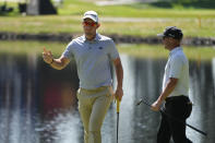 Lucas Herbert, of Australia, reacts after making a birdie putt on the 17th green of the Silverado Resort North Course as Andrew Landry, right, looks on during the first round of the Fortinet Championship PGA golf tournament in Napa, Calif., Thursday, Sept. 14, 2023. (AP Photo/Eric Risberg)