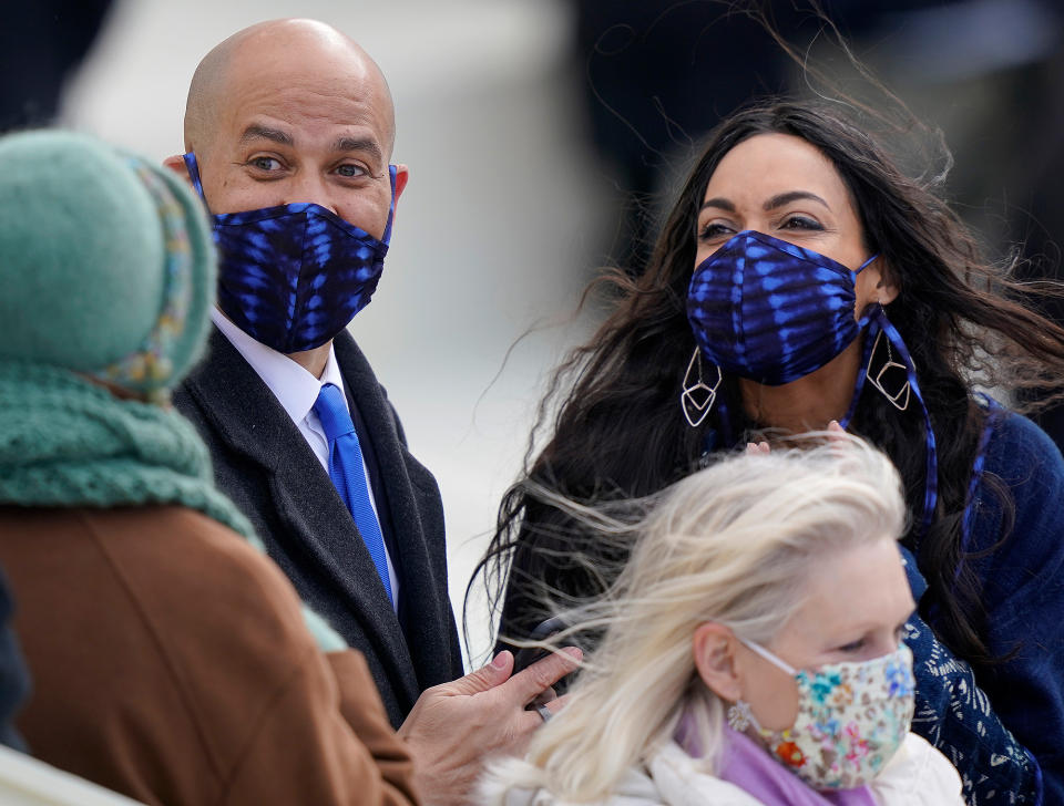 <p>Senator Cory Booker and his girlfriend, actress Rosario Dawson, wear matching masks to the inauguration on Wednesday. </p>
