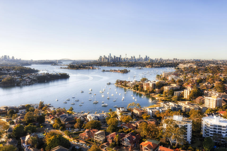 Aerial view of residential property in inner-western Sydney, with the harbour and CBD in the background.