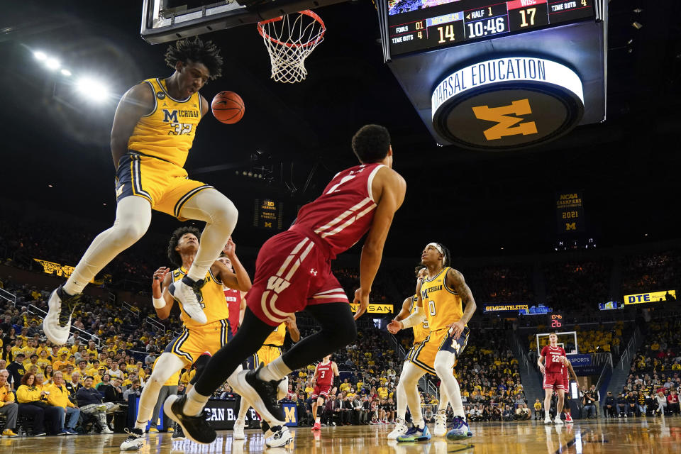 Michigan forward Tarris Reed Jr. (32) blocks a Wisconsin guard Jordan Davis (2) shot in the first half of an NCAA college basketball game in Ann Arbor, Mich., Sunday, Feb. 26, 2023. (AP Photo/Paul Sancya)