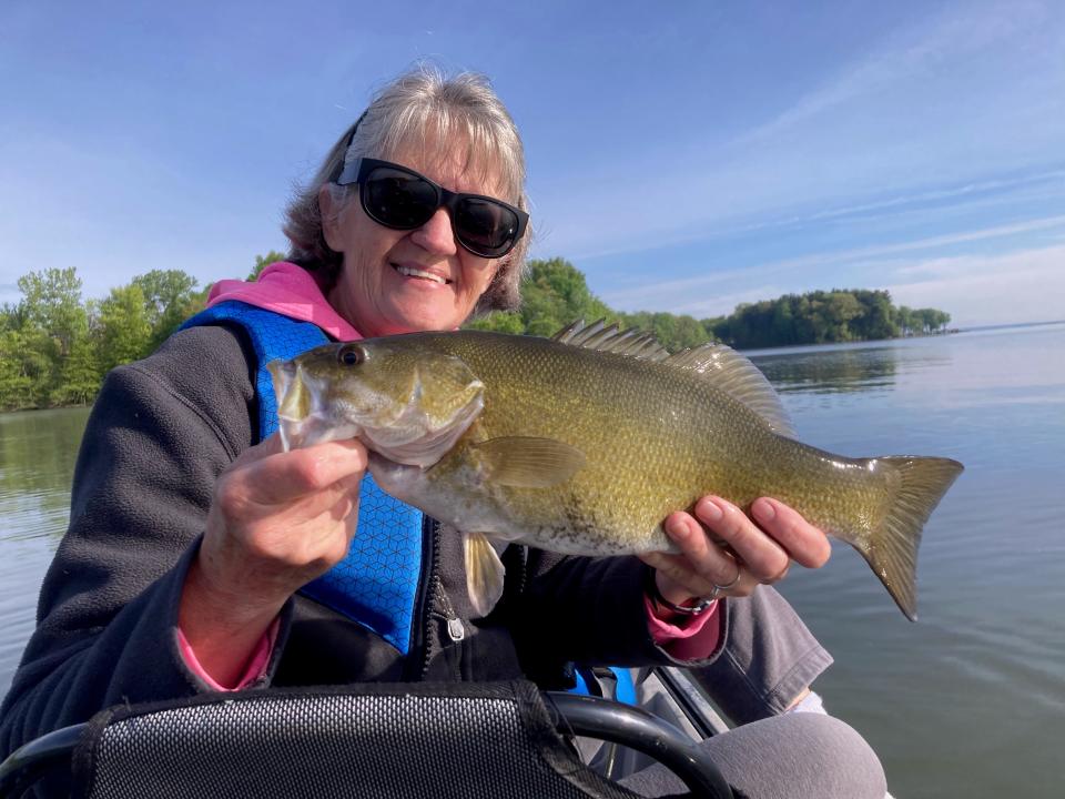 Jean Holden was on fire catching smallmouth bass, including many 16-inchers like this plump bronze back.