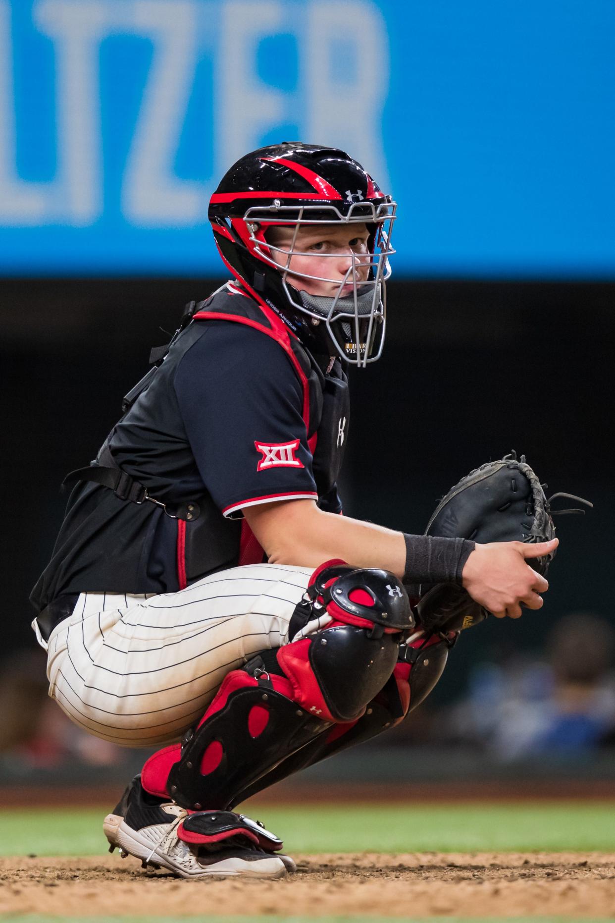 Texas Tech catcher Hudson White (5) looks to the dugout against Michigan during the State Farm College Baseball Showdown on Friday, Feb. 18, 2022, at Globe Life Field in Arlington, Texas.