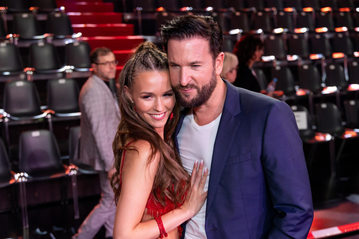 COLOGNE, GERMANY - FEBRUARY 21:  Michael Wendler and Laura Mueller pose on stage during the pre-show 