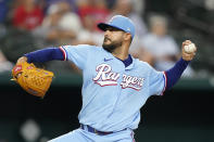 Texas Rangers starting pitcher Martin Perez throws during the first inning of a baseball game against the Seattle Mariners in Arlington, Texas, Sunday, Aug. 14, 2022. (AP Photo/LM Otero)