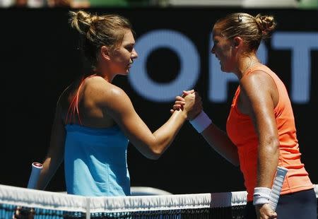 Tennis - Australian Open - Melbourne Park, Melbourne, Australia - 16/1/17 Shelby Rogers of the U.S. shakes hands after winning her Women's singles first round match against Romania's Simona Halep. REUTERS/Thomas Peter