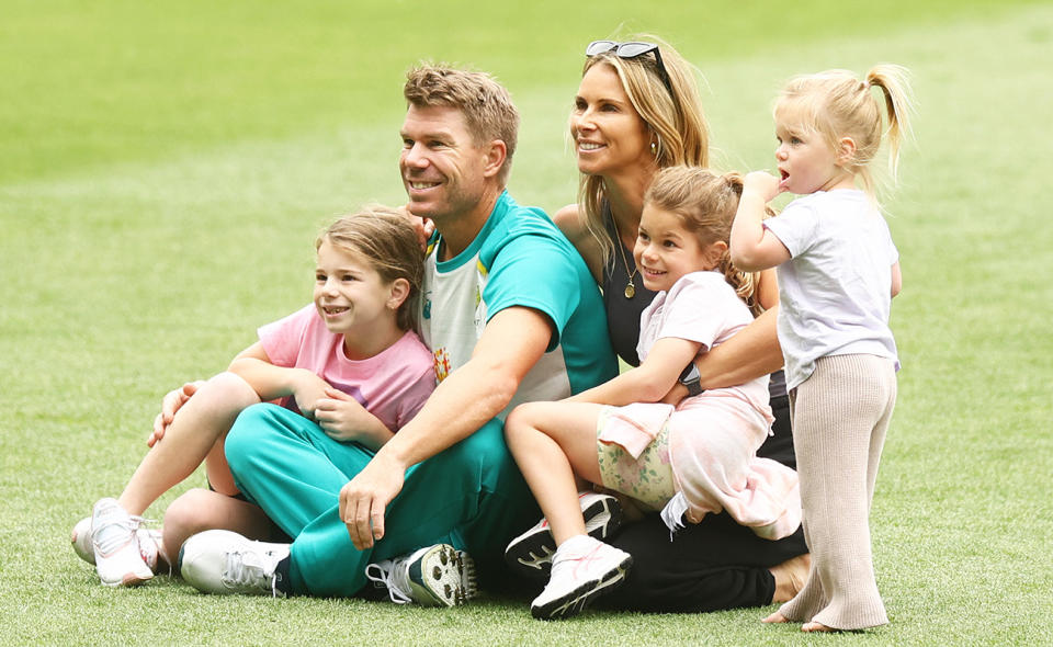 David Warner, pictured here with wife Candice and their children at the MCG in 2021.