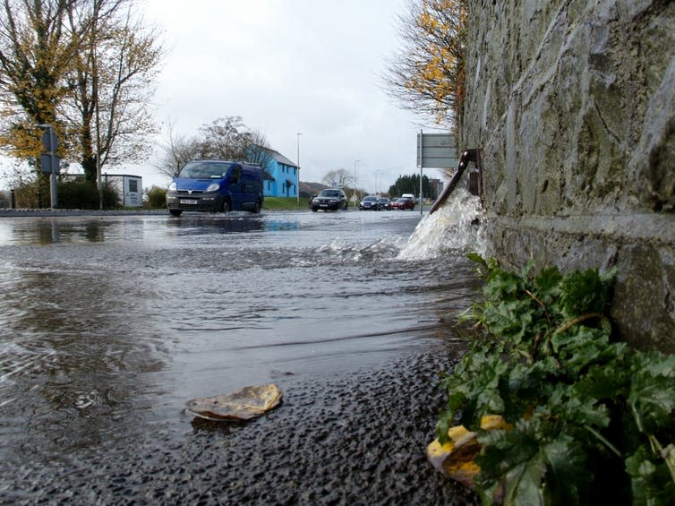 <span class="caption">Water flooding from a drain in Carmarthen, UK.</span> <span class="attribution"><a class="link " href="https://www.shutterstock.com/image-photo/10th-november-2018-water-flowing-out-1227100885?src=JbkZ6BxPUa-mRx-qiXD7xA-1-40" rel="nofollow noopener" target="_blank" data-ylk="slk:J. Hime/Shutterstock.;elm:context_link;itc:0;sec:content-canvas">J. Hime/Shutterstock.</a></span>