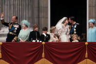 <p>Newlyweds Princess Diana and Prince Charles kiss on the balcony at Buckingham Palace just after their wedding, surrounded by Queen and other members of Royal Family, as well as children from their wedding party. (CORBIS/Corbis via Getty Images)</p> 