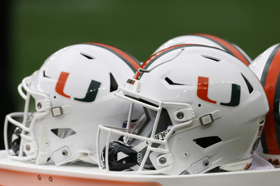 Oct. 30, 2021; Pittsburgh, Pennsylvania; Miami Hurricanes helmets sit on the sidelines against the Pittsburgh Panthers during the third quarter at Heinz Field. Charles LeClaire-USA TODAY Sports