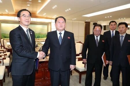 Head of the North Korean delegation, Ri Son Gwon shakes hands with South Korean counterpart Cho Myoung-gyon after their meeting at the truce village of Panmunjom in the demilitarised zone separating the two Koreas, South Korea, January 9, 2018. Yonhap via REUTERS ATTENTION EDITORS - THIS IMAGE HAS BEEN SUPPLIED BY A THIRD PARTY. SOUTH KOREA OUT. NO RESALES. NO ARCHIVE.