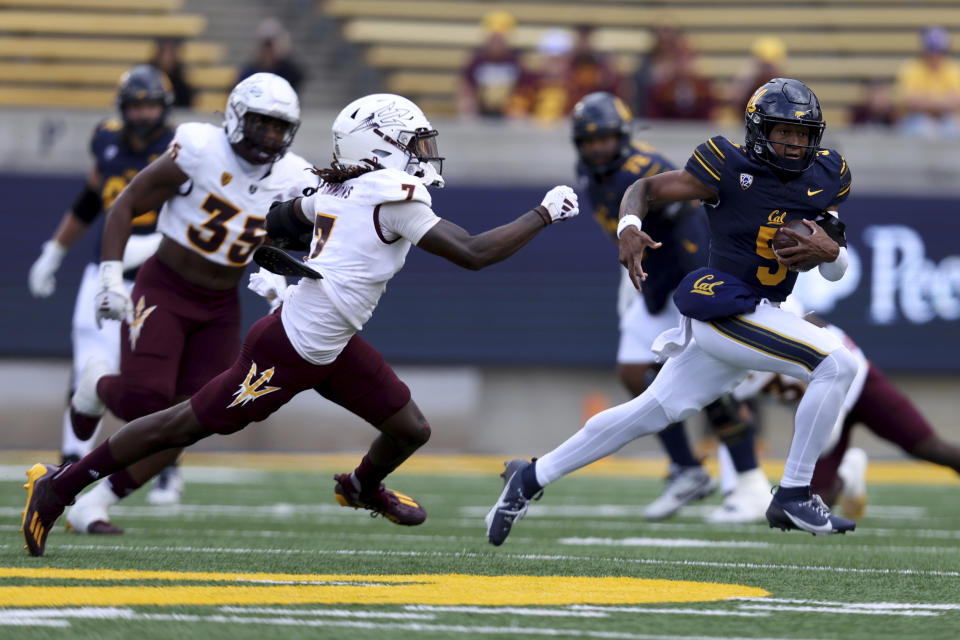 California quarterback Sam Jackson V (5) runs against Arizona State defensive back Shamari Simmons (7) during the first half of an NCAA college football game in Berkeley, Calif., Saturday, Sept. 30, 2023. (AP Photo/Jed Jacobsohn)