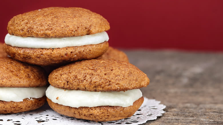 Pumpkin whoopie pies on table