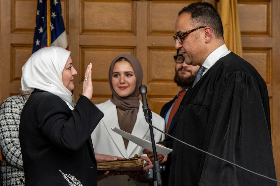 Nadia Kahf, a family law and immigration attorney from Wayne, is sworn by Hany Mawla as judge of the New Jersey Superior Court during a ceremony in Paterson, NJ on Tuesday, March 21, 2023. Nawal Al Qudah and Abdullah Al Qudah watch as Kahf is sworn in. 