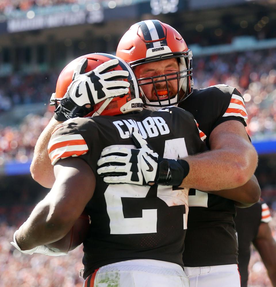 Cleveland Browns offensive guard Blake Hance (62) celebrates with Cleveland Browns running back Nick Chubb (24) after a rushing touchdown during the second half of an NFL football game against the Houston Texans, Sunday, Sept. 19, 2021, in Cleveland, Ohio.