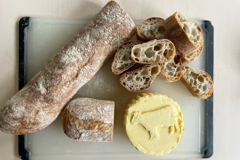 Sliced bread next to Rodolphe Le Meunier butter.