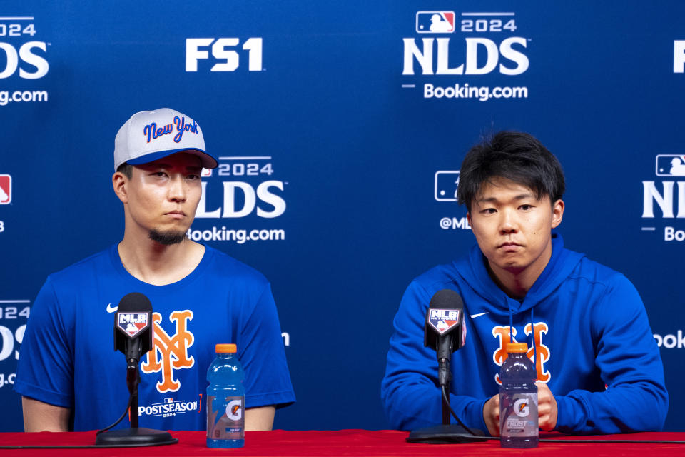 New York Mets' Kodai Senga, left, speaks alongside his interpreter Hiro Fujiwara, right, during a baseball news conference, Friday, Oct. 4, 2024, in Philadelphia, ahead of the National League Division Series against the Philadelphia Phillies. (AP Photo/Chris Szagola)