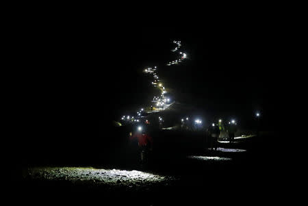 Competitors climb during the 16th Ultra-Trail du Mont-Blanc (UTMB) race at La Balme near Chamonix, France August 31, 2018. REUTERS/Denis Balibouse