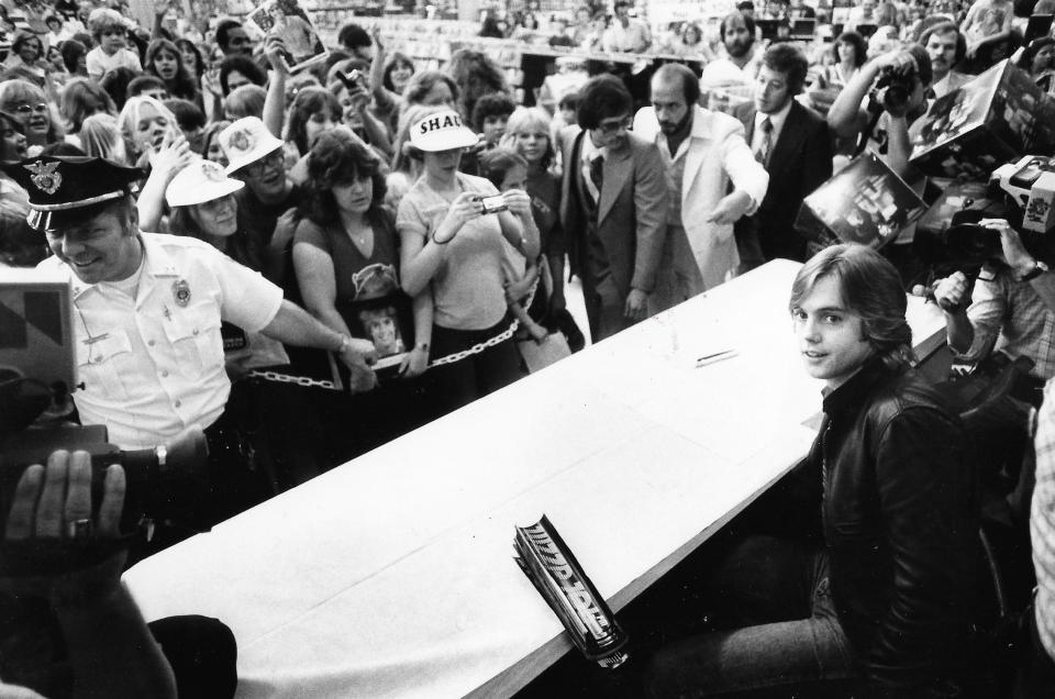 Pop star Shaun Cassidy takes a seat at Grapevine Records & Tapes on Aug. 28, 1979, before signing autographs for Akron fans.