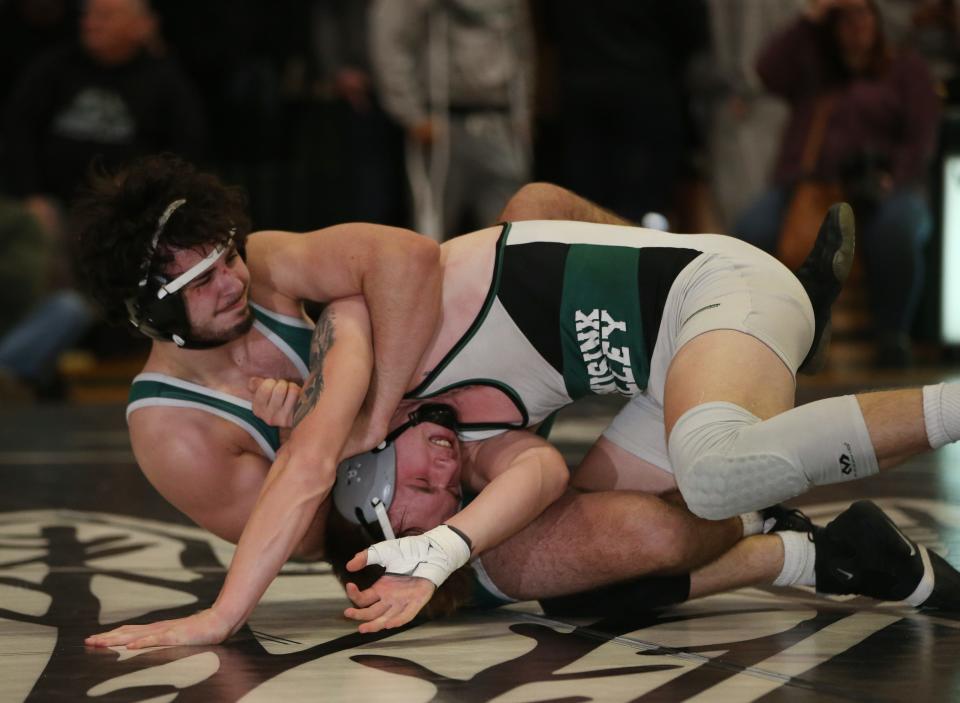 From left, Cornwall's Nick Cavallo and Minisink Valley's Zach Filip wrestle in the 172 lb match during the Section 9 Duals final at Minisink Valley High School on January 11, 2023.